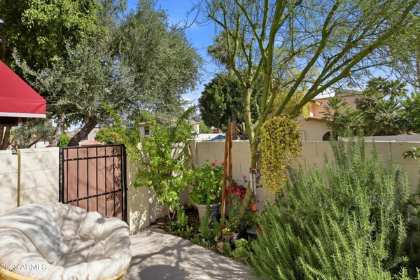 a view of backyard of house with green space