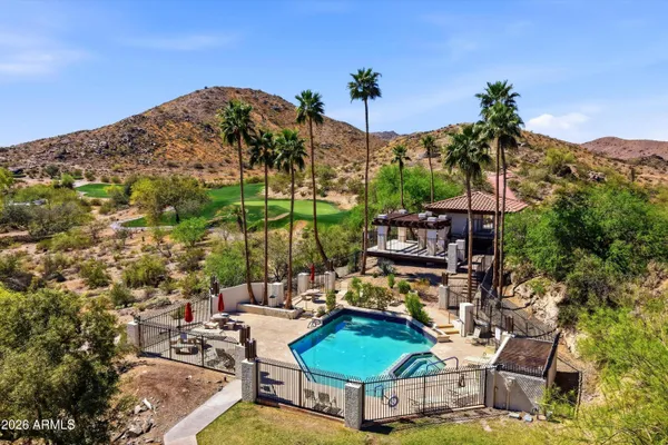 a view of a chairs and table in the patio