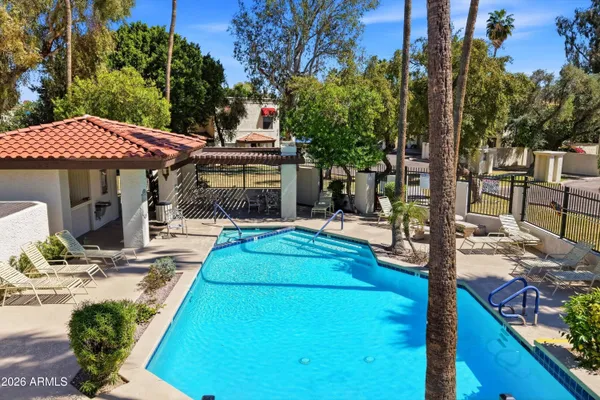 a view of swimming pool with outdoor seating