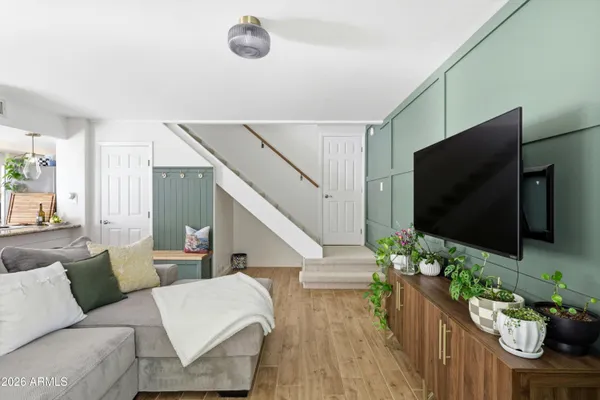 a living room with furniture and a flat screen tv