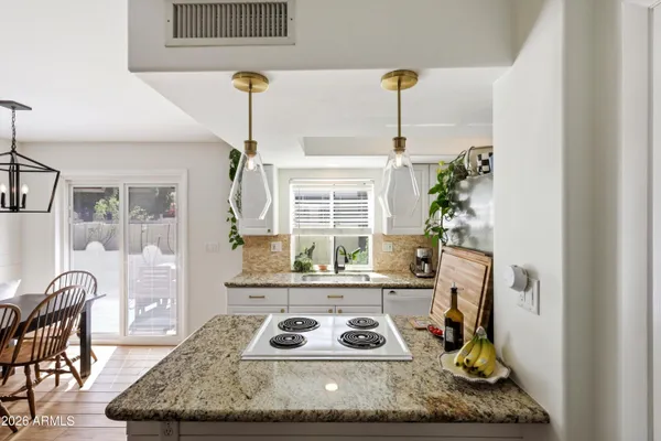 a living room with furniture and next to a window