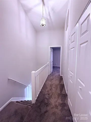 a view of a hallway with staircase