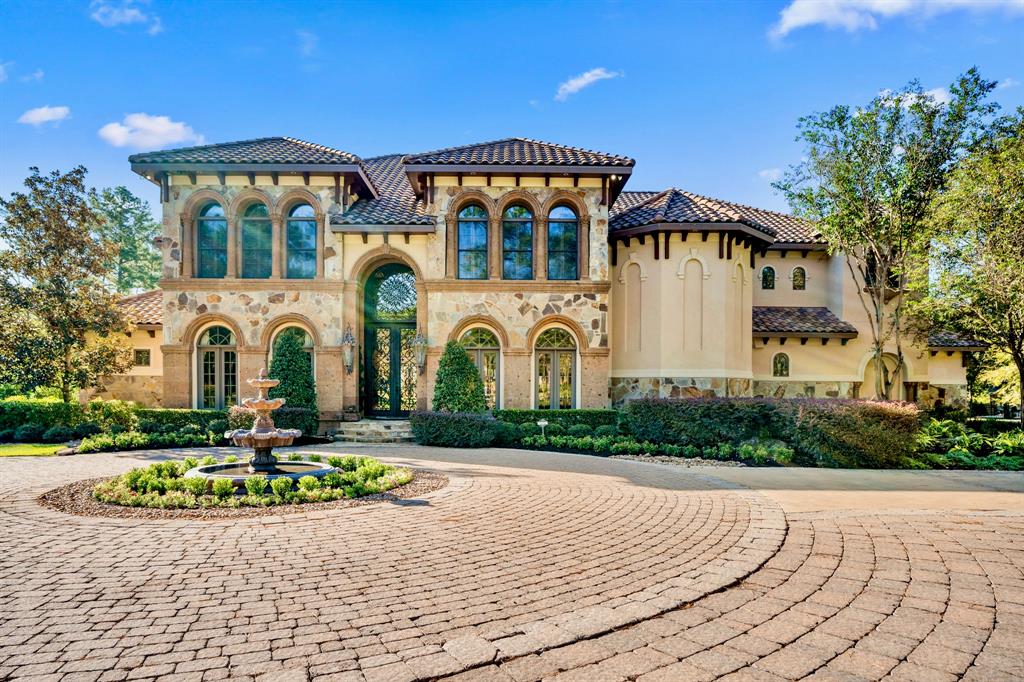 28322 Meadow Forest Magnolia, TX 77355 - Photo 1 of 50 Masterfully designed Mediterranean-style custom home features handcrafted finishes throughout. Situated on the green of Hole #1 at High Meadow Ranch Golf Course on just over 4 fully fenced & landscaped acres.