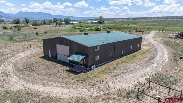 a view of a lake with a building in the background