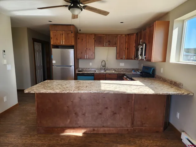 a white refrigerator freezer sitting inside of a kitchen