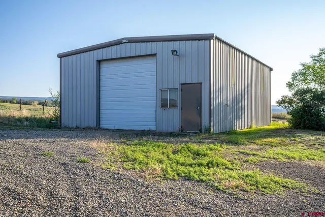 a view of a dirt road with mountain view
