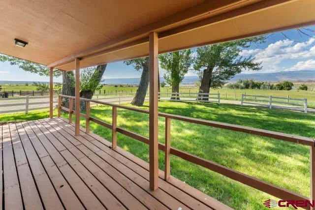 a view of deck with a yard