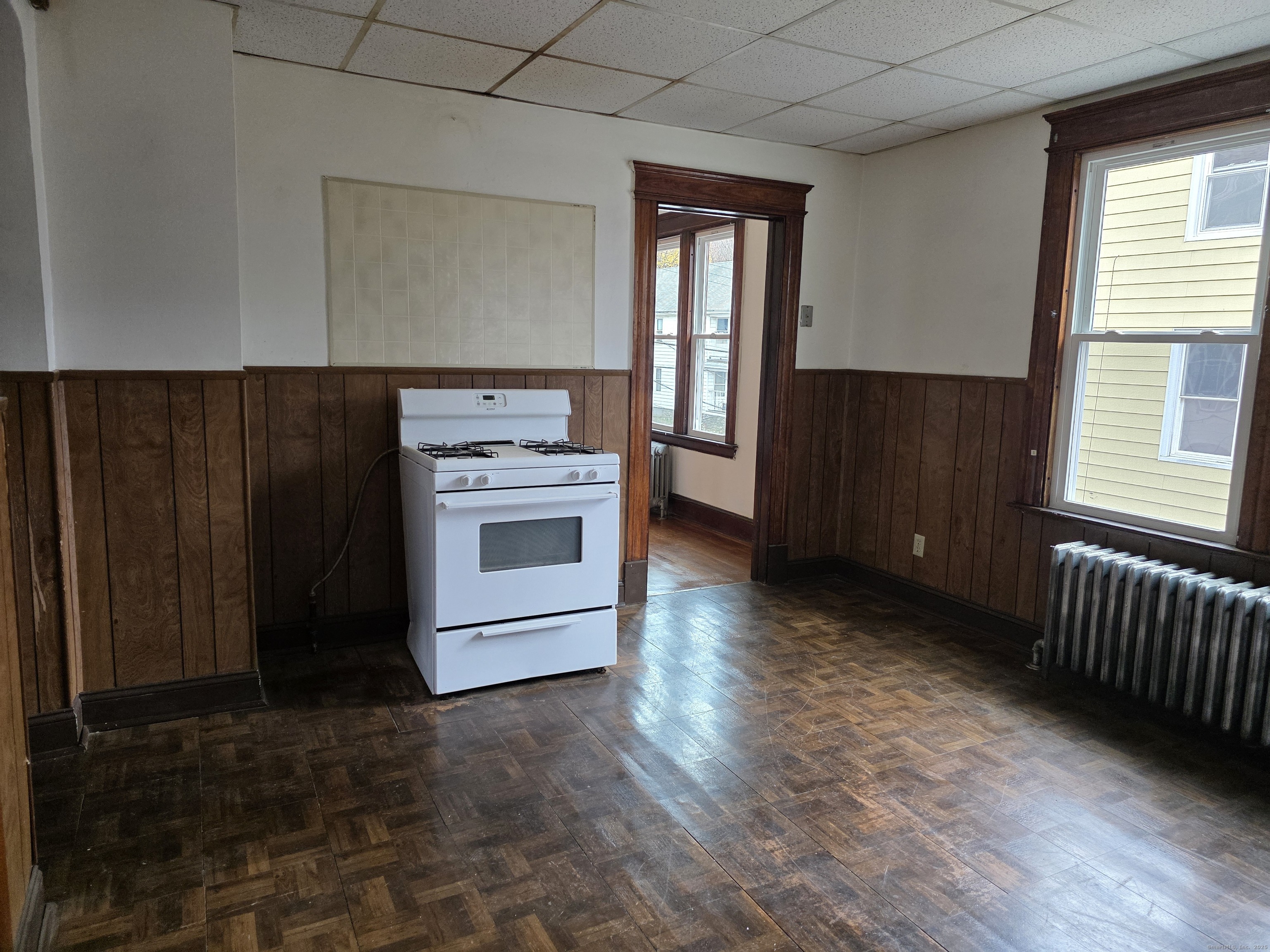 166 Oak Street, Unit 2 Waterbury, CT 06704 - Photo 2 of 13 a kitchen with a stove and a refrigerator