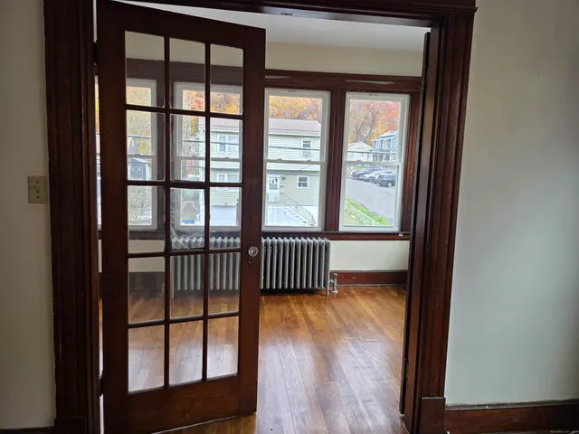 a view of bedroom with wooden floor
