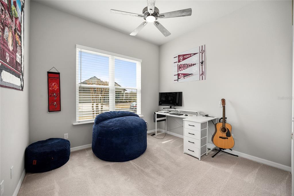 12092 Southwest 29th Place Gainesville, FL 32608 - Photo 17 of 38 a bedroom with furniture and a window