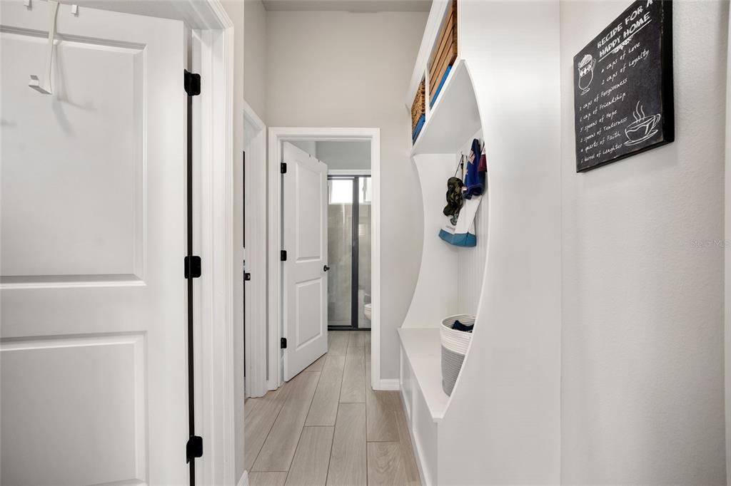 12092 Southwest 29th Place Gainesville, FL 32608 - Photo 23 of 38 a view of a hallway with wooden floor and staircase