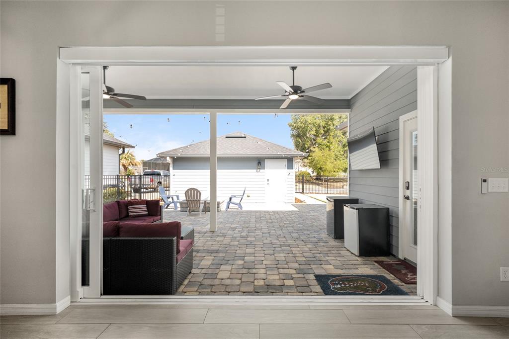 12092 Southwest 29th Place Gainesville, FL 32608 - Photo 25 of 38 a kitchen with stainless steel appliances kitchen island granite countertop a refrigerator and a stove top oven
