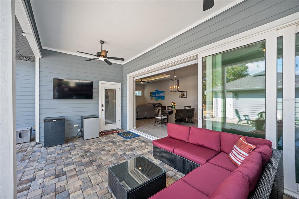 12092 Southwest 29th Place Gainesville, FL 32608 - Photo 27 of 38 a living room with furniture and a flat screen tv
