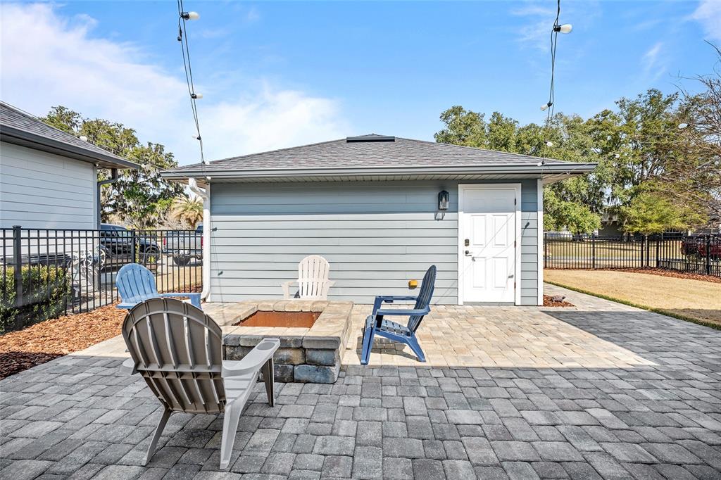 12092 Southwest 29th Place Gainesville, FL 32608 - Photo 30 of 38 a backyard of a house with table and chairs