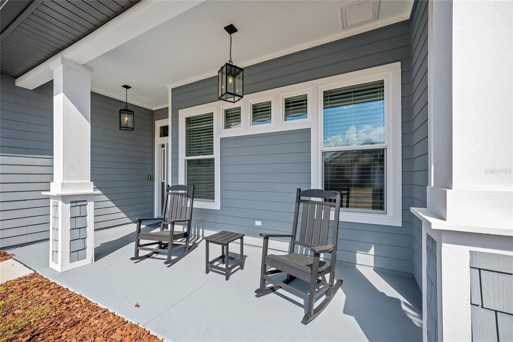 12092 Southwest 29th Place Gainesville, FL 32608 - Photo 3 of 38 a view of a patio with a couple of chairs