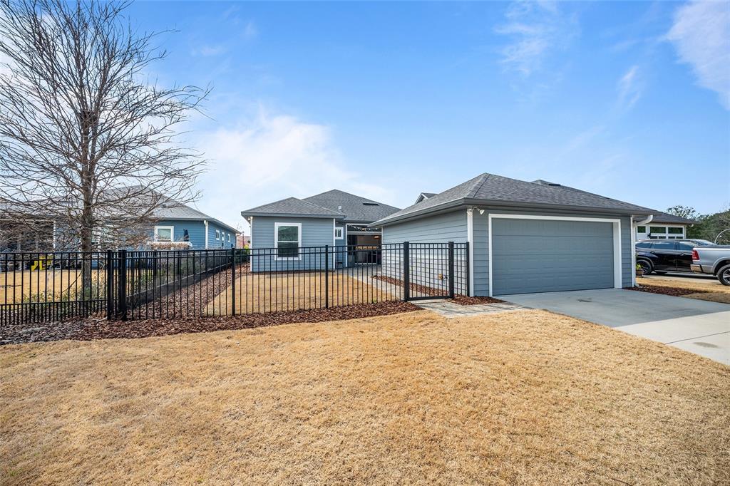 12092 Southwest 29th Place Gainesville, FL 32608 - Photo 32 of 38 a house with swimming pool in front of it