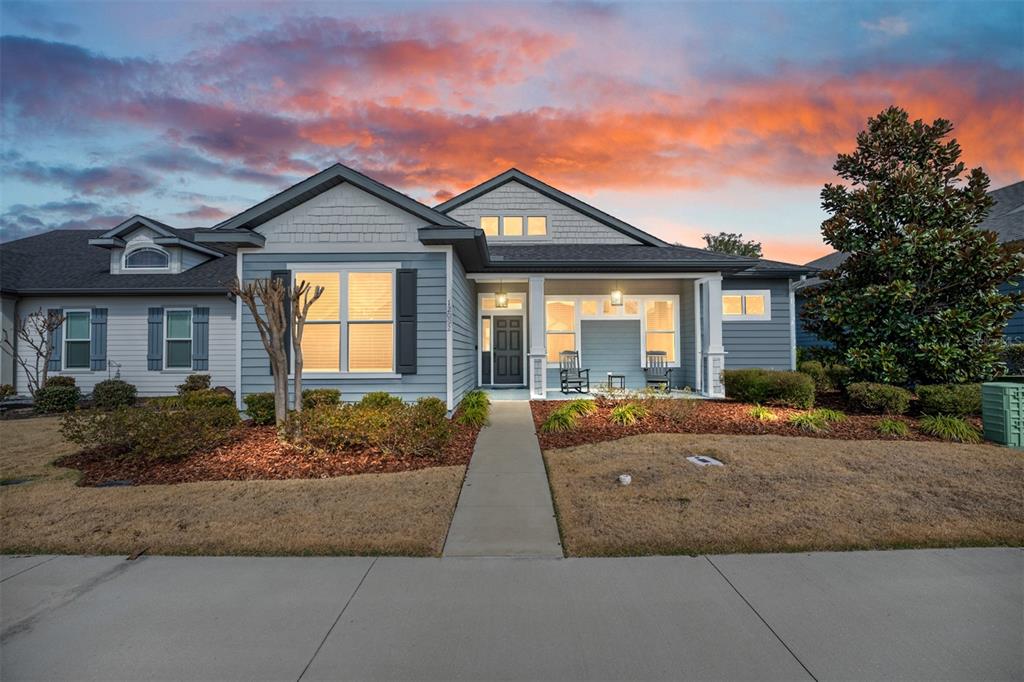 12092 Southwest 29th Place Gainesville, FL 32608 - Photo 33 of 38 a front view of a house with garden