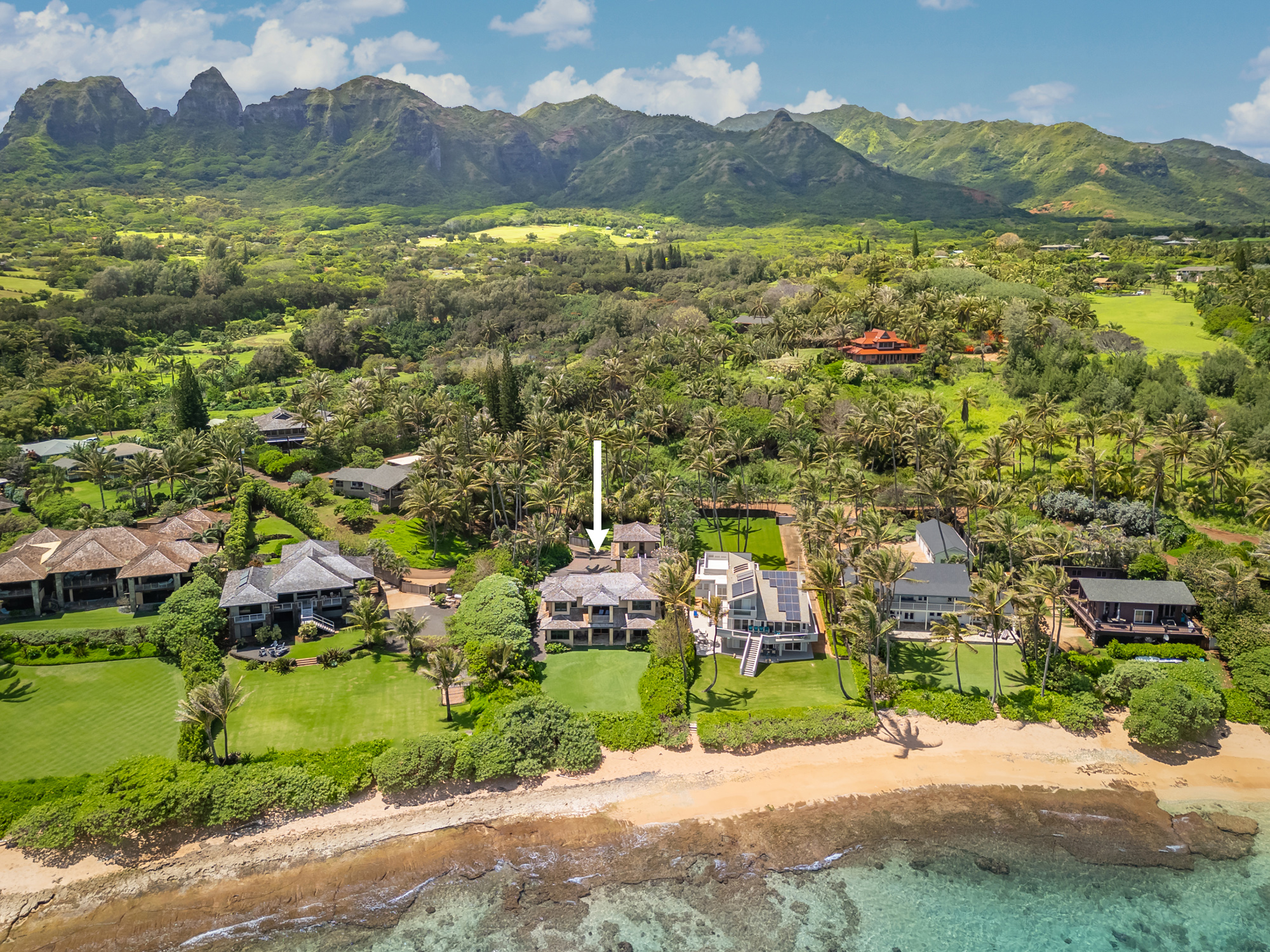 a view of a town with mountains in the background