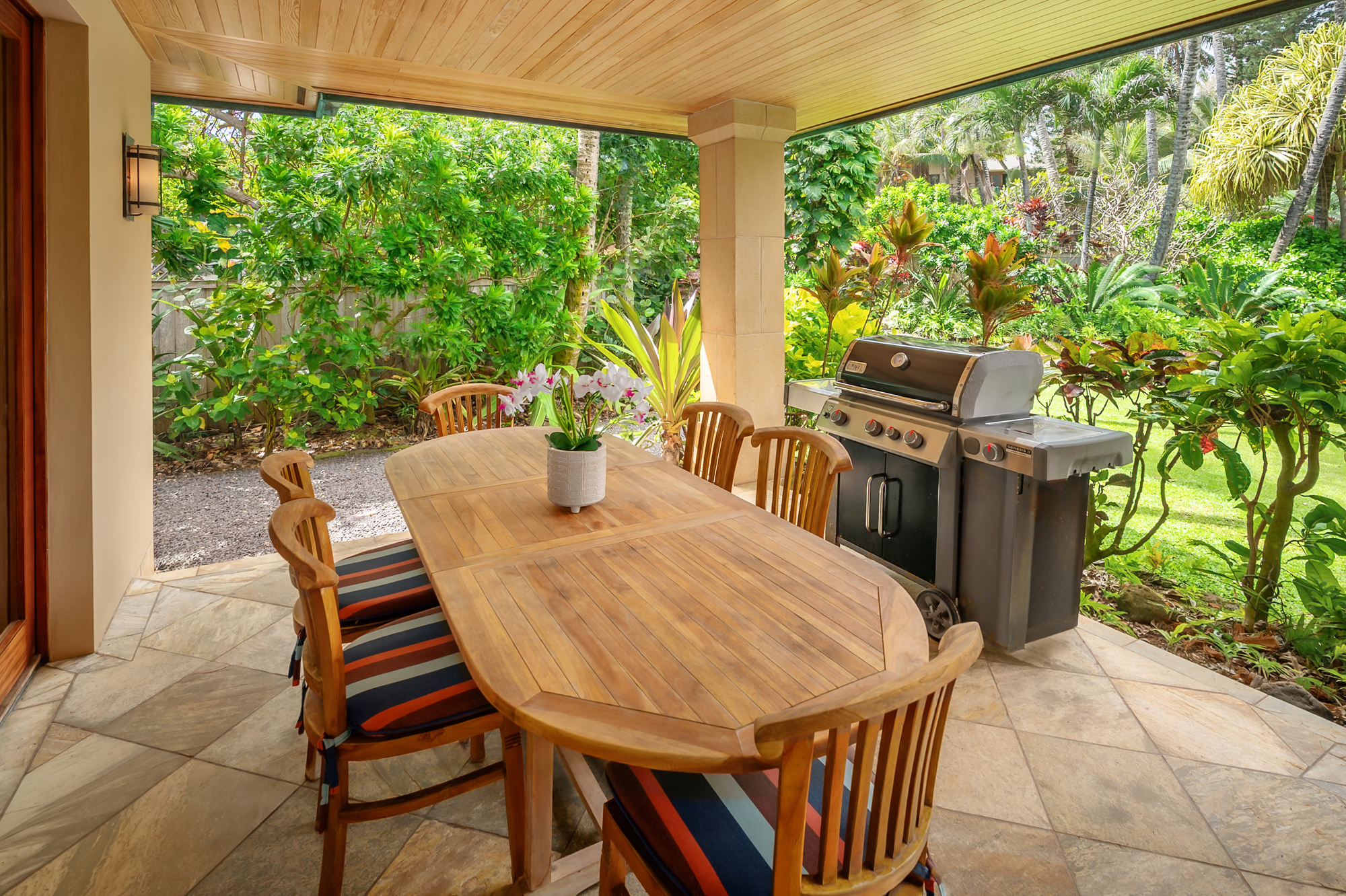 5070 Kukuna Road Kilauea, HI 96754 - Photo 11 of 29 a view of an outdoor dining space with a table and chairs