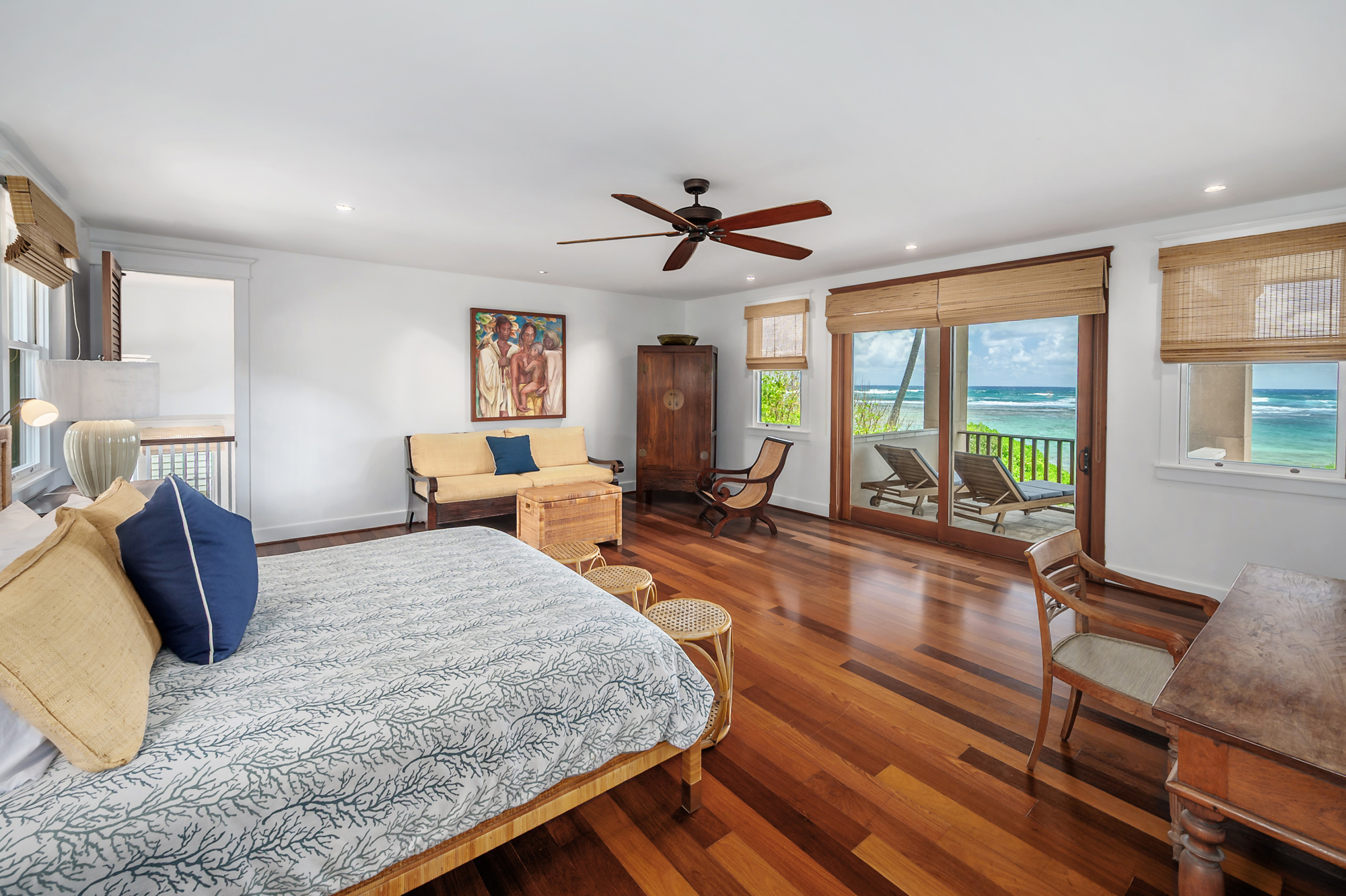 5070 Kukuna Road Kilauea, HI 96754 - Photo 12 of 29 a living room with furniture and a large window
