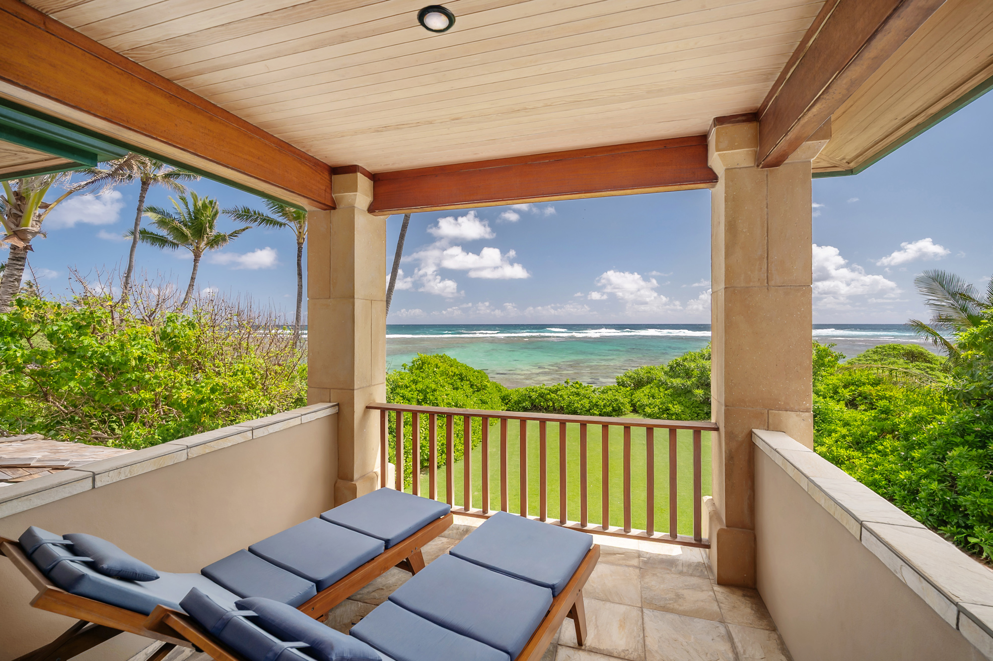 5070 Kukuna Road Kilauea, HI 96754 - Photo 15 of 29 a view of a balcony with furniture