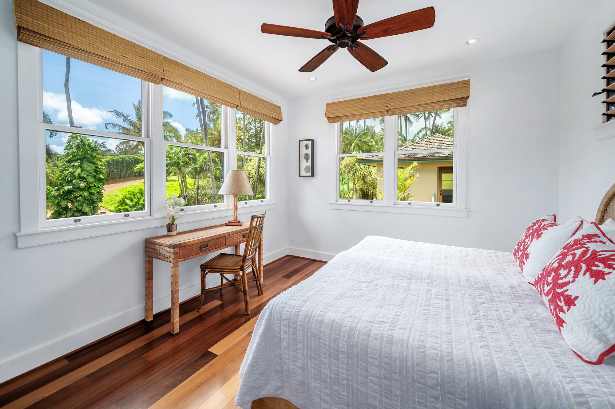 5070 Kukuna Road Kilauea, HI 96754 - Photo 18 of 29 a bedroom with a bed and a table