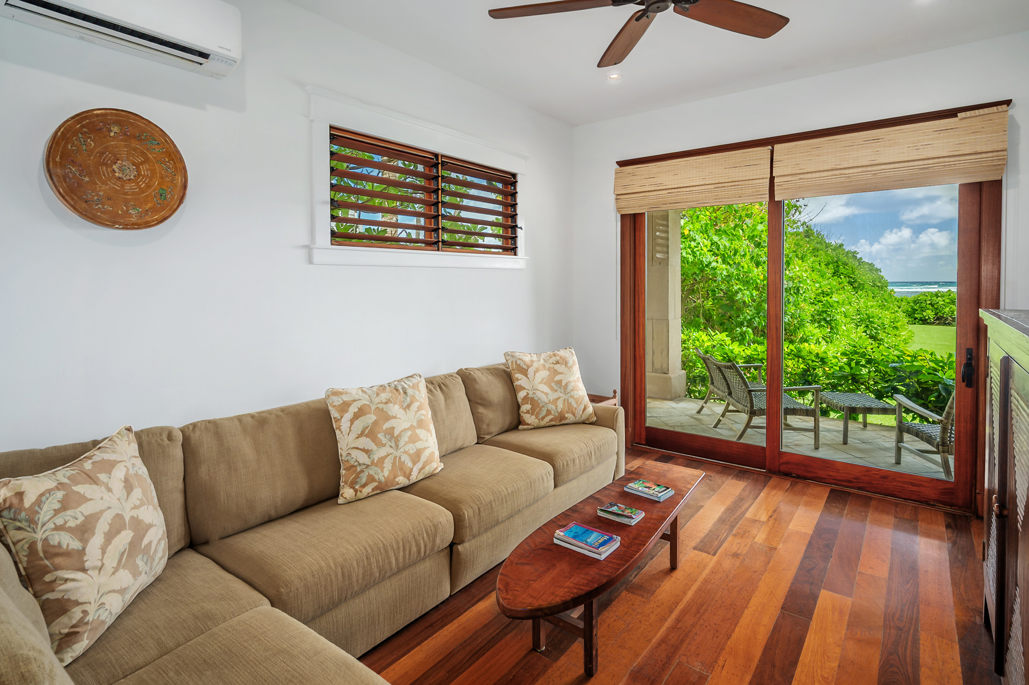 5070 Kukuna Road Kilauea, HI 96754 - Photo 19 of 29 a living room with furniture and a window