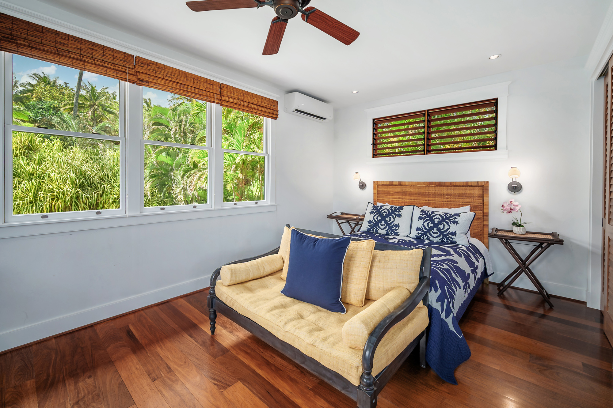 5070 Kukuna Road Kilauea, HI 96754 - Photo 23 of 29 a bedroom with furniture and a window