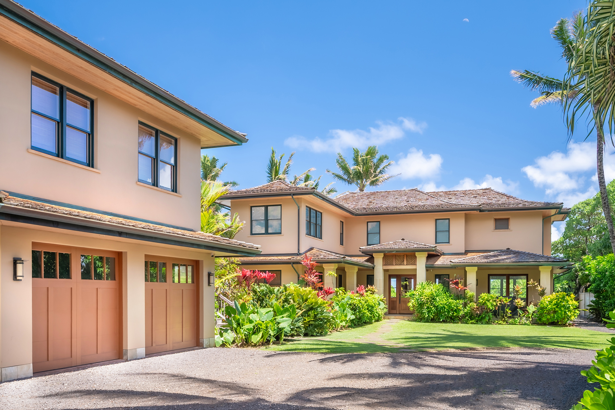 5070 Kukuna Road Kilauea, HI 96754 - Photo 24 of 29 a front view of a house with a garden