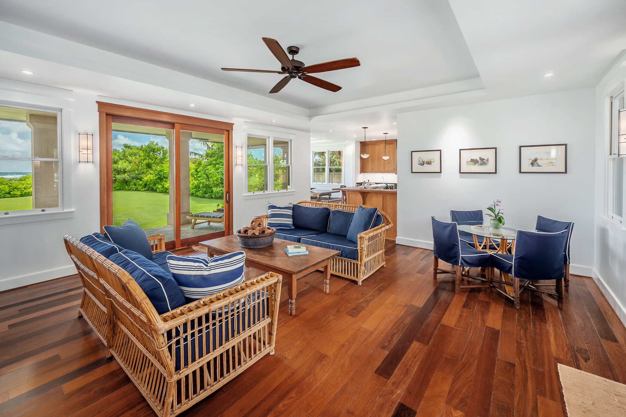 5070 Kukuna Road Kilauea, HI 96754 - Photo 6 of 29 a living room with furniture and a wooden floor