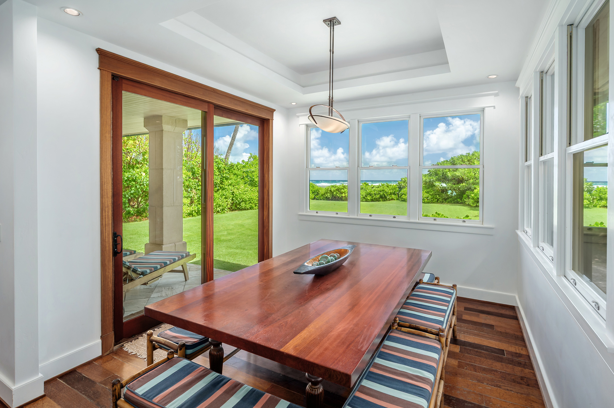 5070 Kukuna Road Kilauea, HI 96754 - Photo 8 of 29 a view of a dining room with furniture window and wooden floor