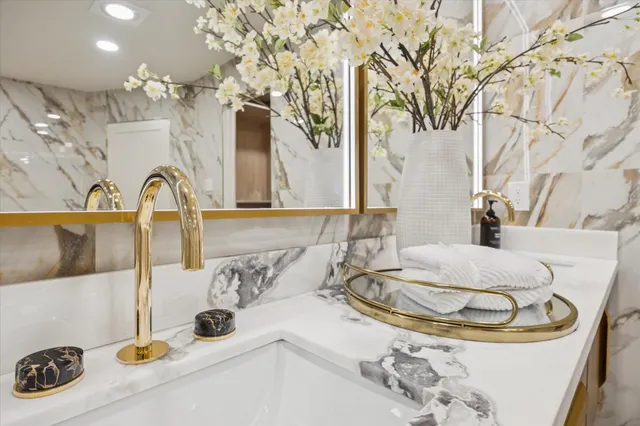 a bathroom with a bathtub and shower