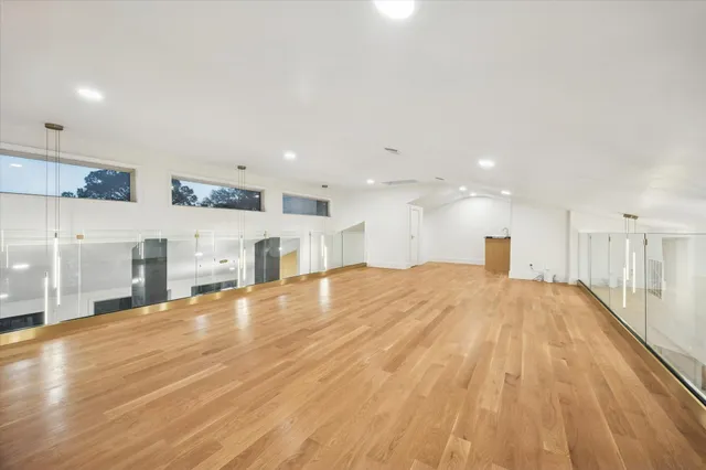 a view of a kitchen with wooden floor