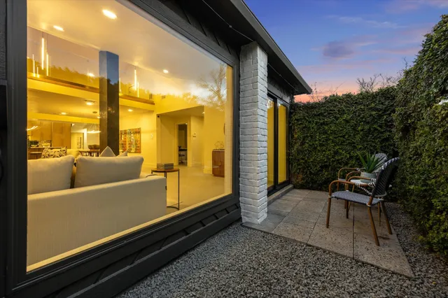an aerial view of multiple houses with yard