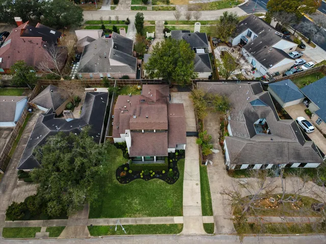 an aerial view of houses with outdoor space