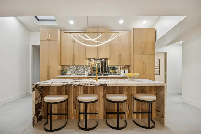 a kitchen with a stove a sink and a refrigerator