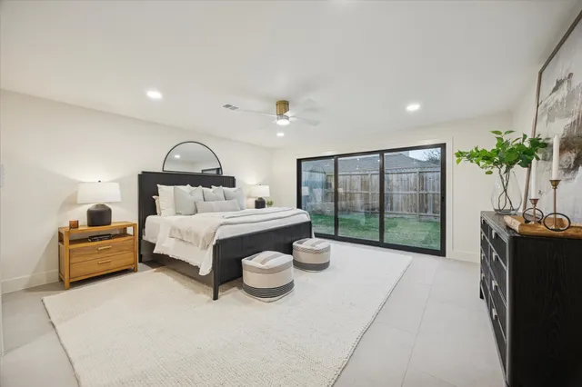 a bathroom with a double vanity sink toilet and shower