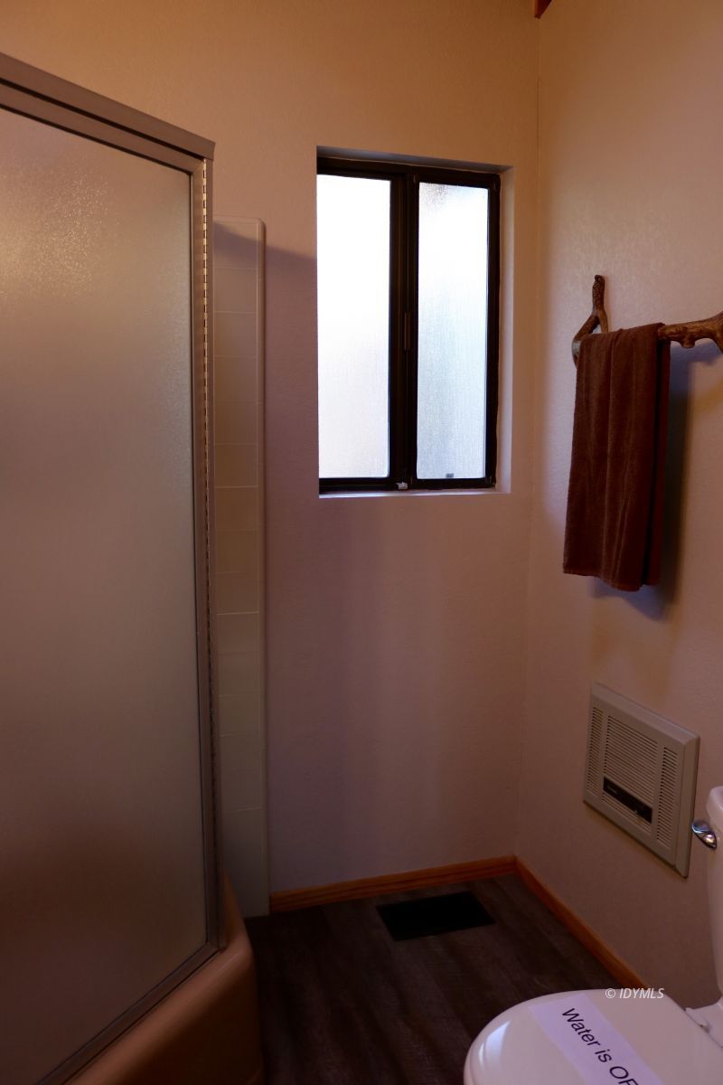 24796 Fern Valley Road Idyllwild, CA 92549 - Photo 15 of 20 a bathroom with a toilet sink and mirror