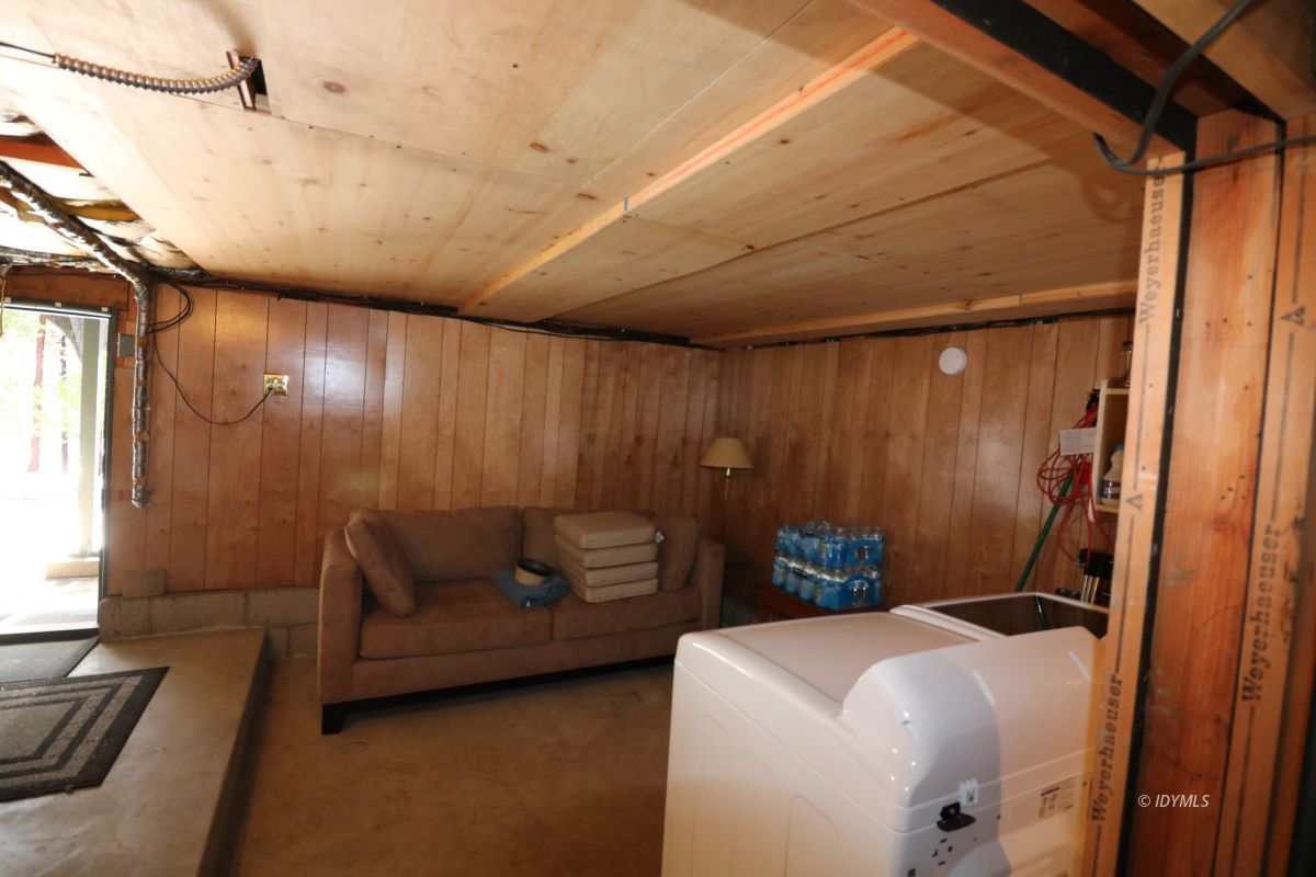 24796 Fern Valley Road Idyllwild, CA 92549 - Photo 18 of 20 a living room with furniture and a window