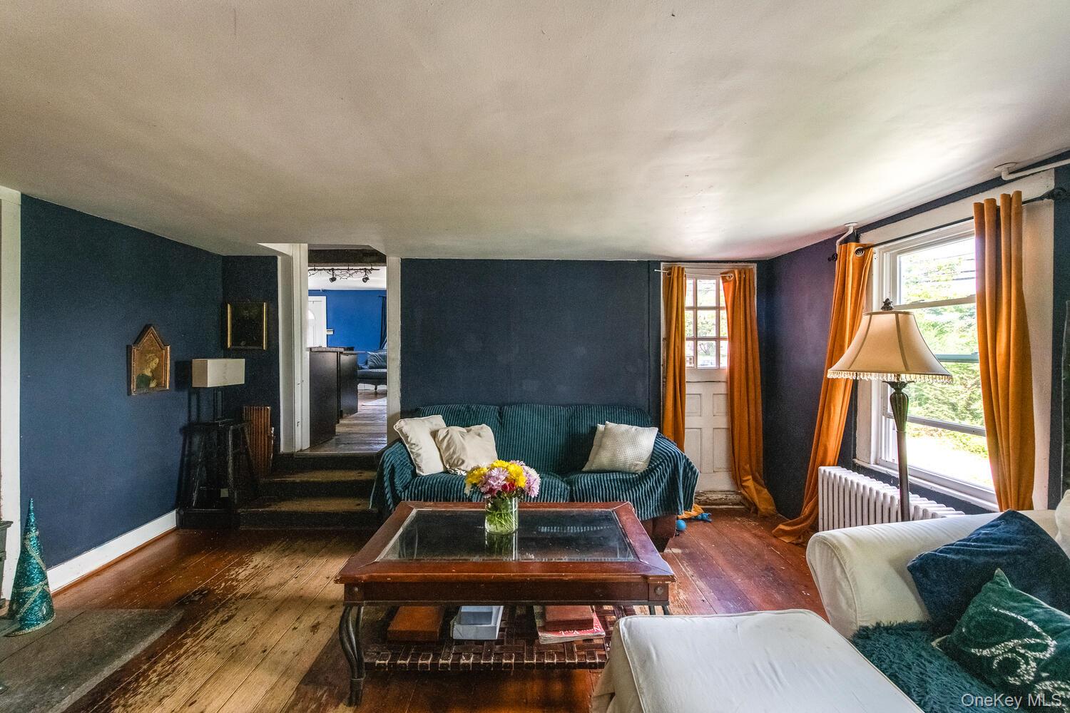 88 South Hamilton Street Poughkeepsie, NY 12601 - Photo 22 of 47 Living room with hardwood floors and radiator heating unit