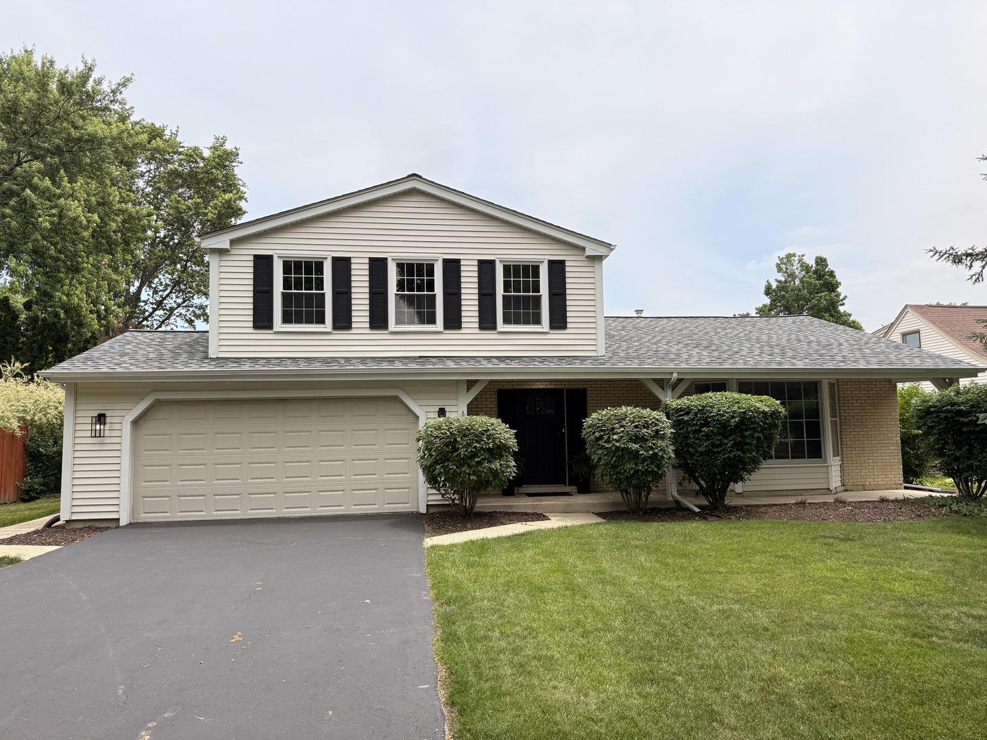 1554 Chickasaw Drive Naperville, IL 60563 - Photo 2 of 32 a front view of a house with a yard