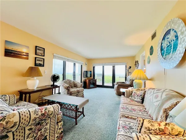 a living room with furniture and a table