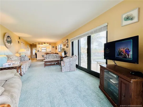 a view of a balcony with chairs