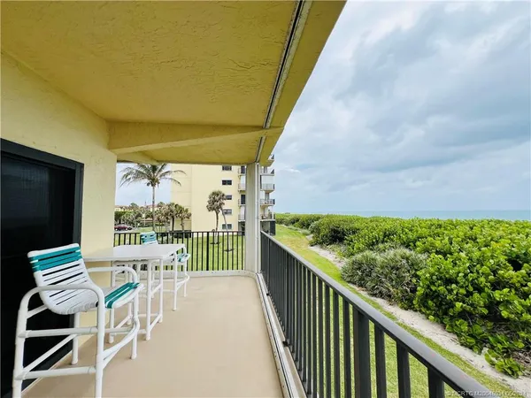 a view of a balcony with an outdoor space