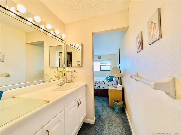 a view of a bathroom with a door and a window