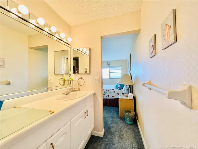 a view of a bathroom with a door and a window