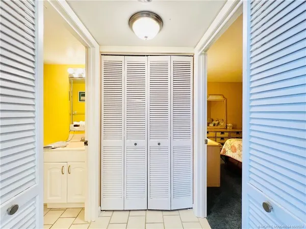 a bedroom with a bed and a night stand