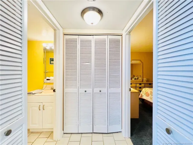 a bedroom with a bed and a night stand