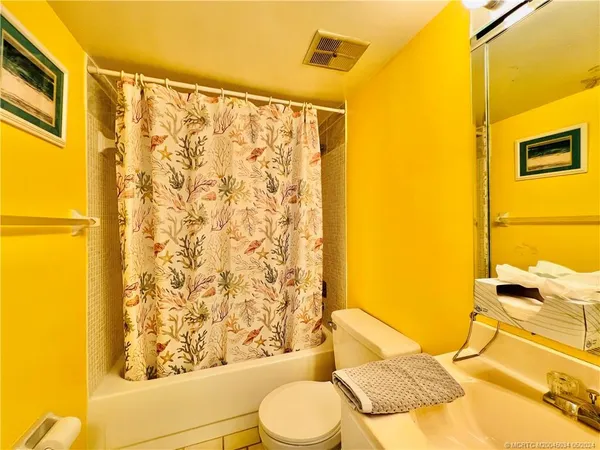 a view of swimming pool with outdoor seating and a buildings