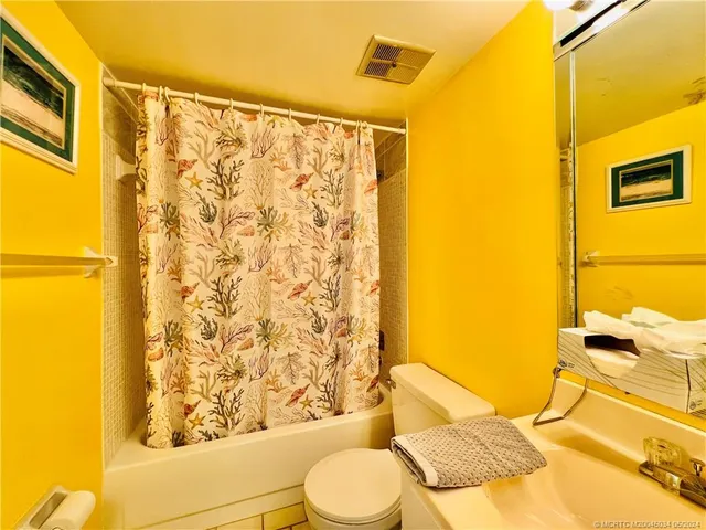 a view of swimming pool with outdoor seating and a buildings